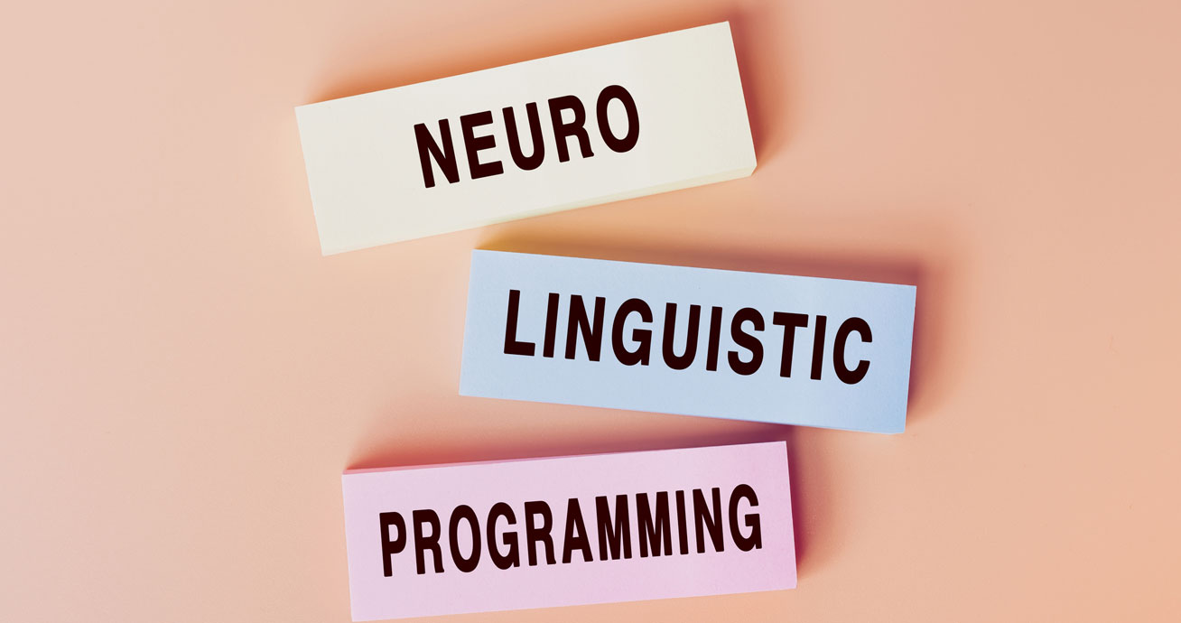 overhead-photo-of-neuro-linguistic-programming-on-colored-paper