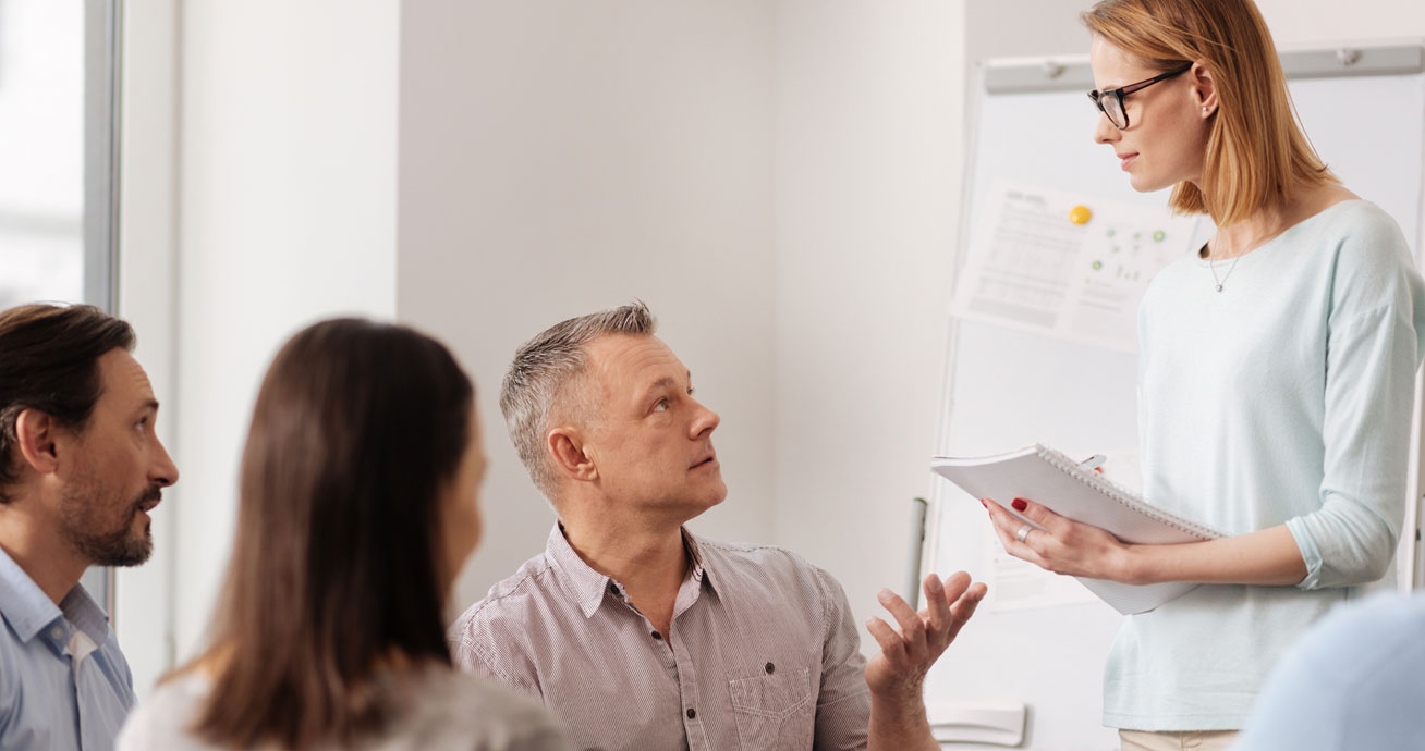 woman-coaching-small-group